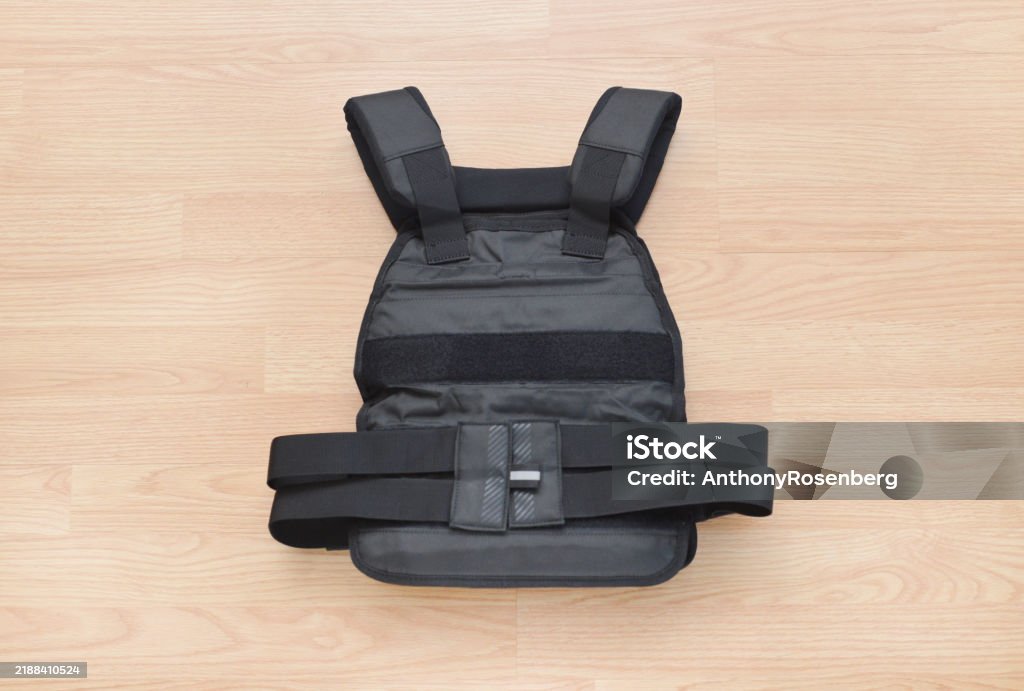 Person wearing a weighted vest during a bodyweight strength workout