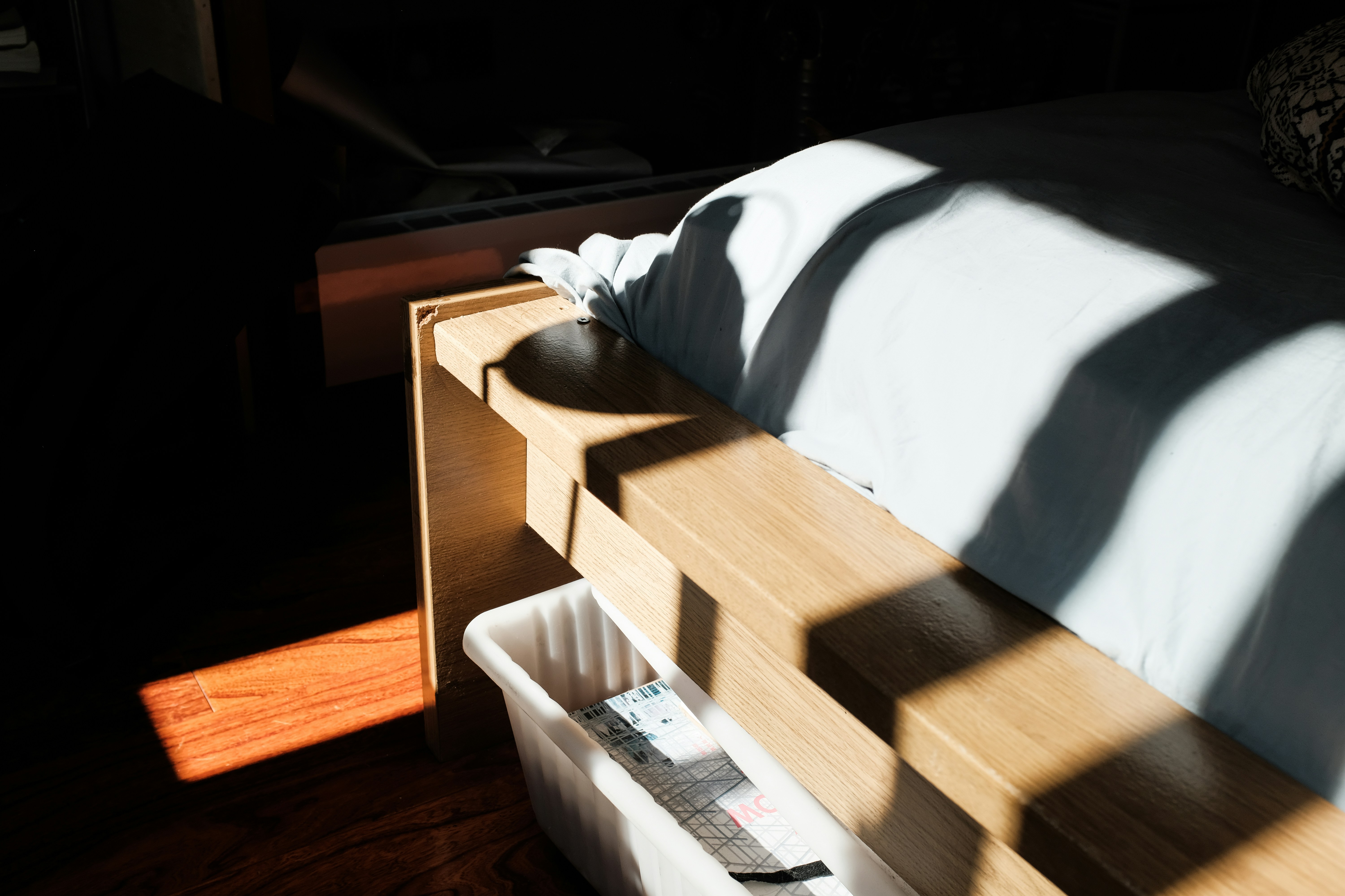 Flat under-bed storage bins for organizing weight plates