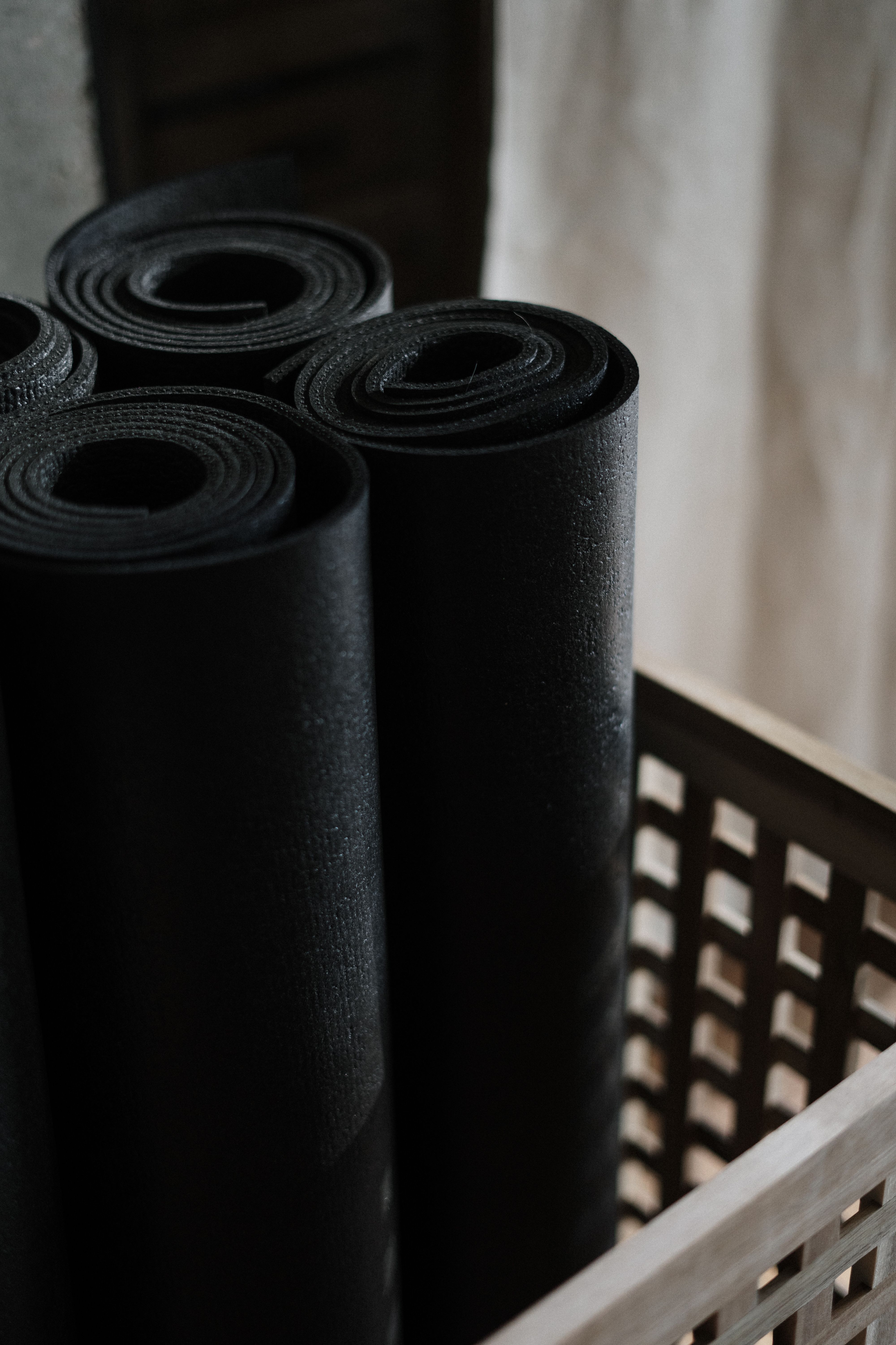 A large rubber exercise mat covering a home gym floor area.