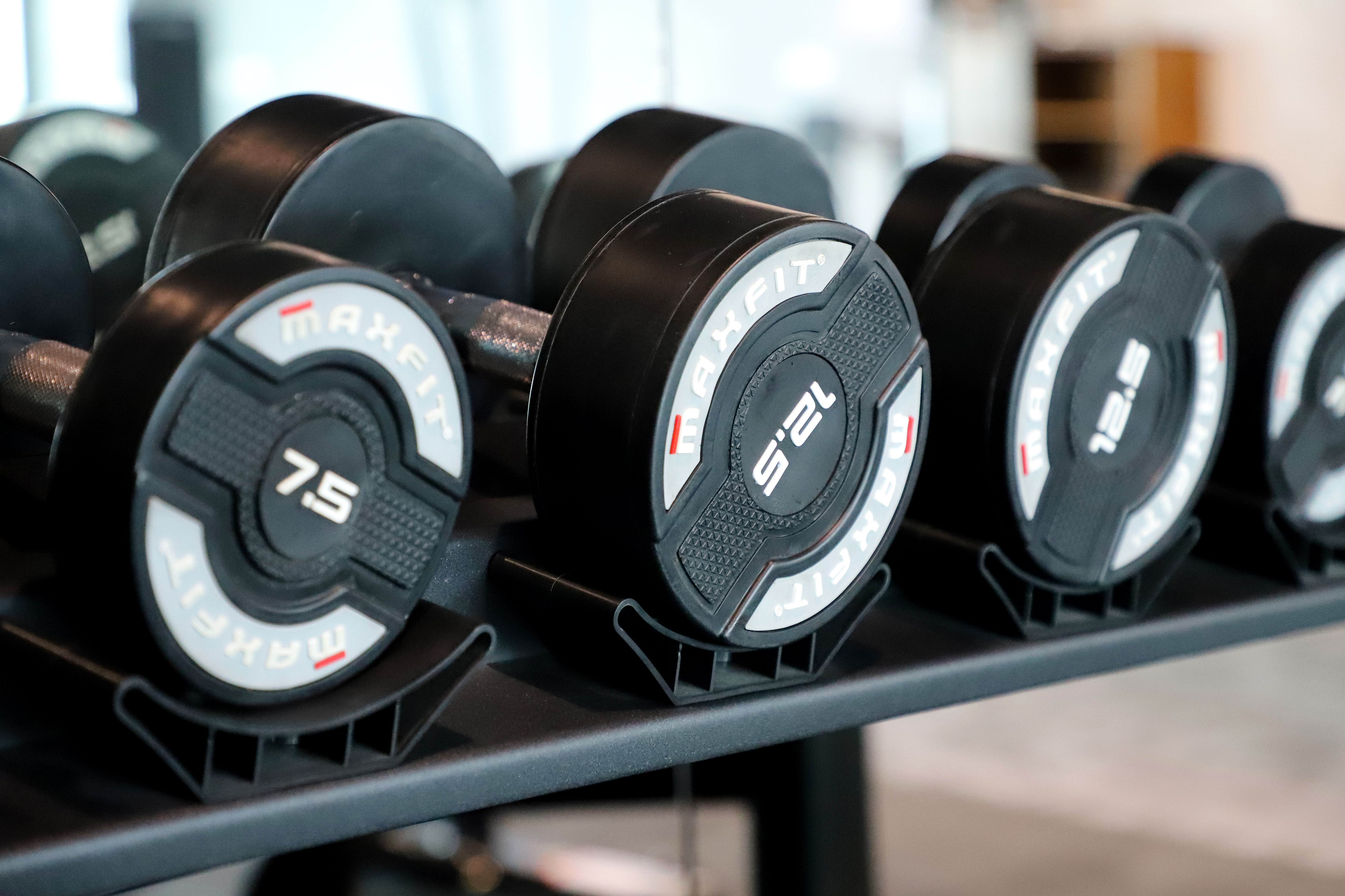 Amazon Basics three-tier dumbbell weight rack for compact apartment storage