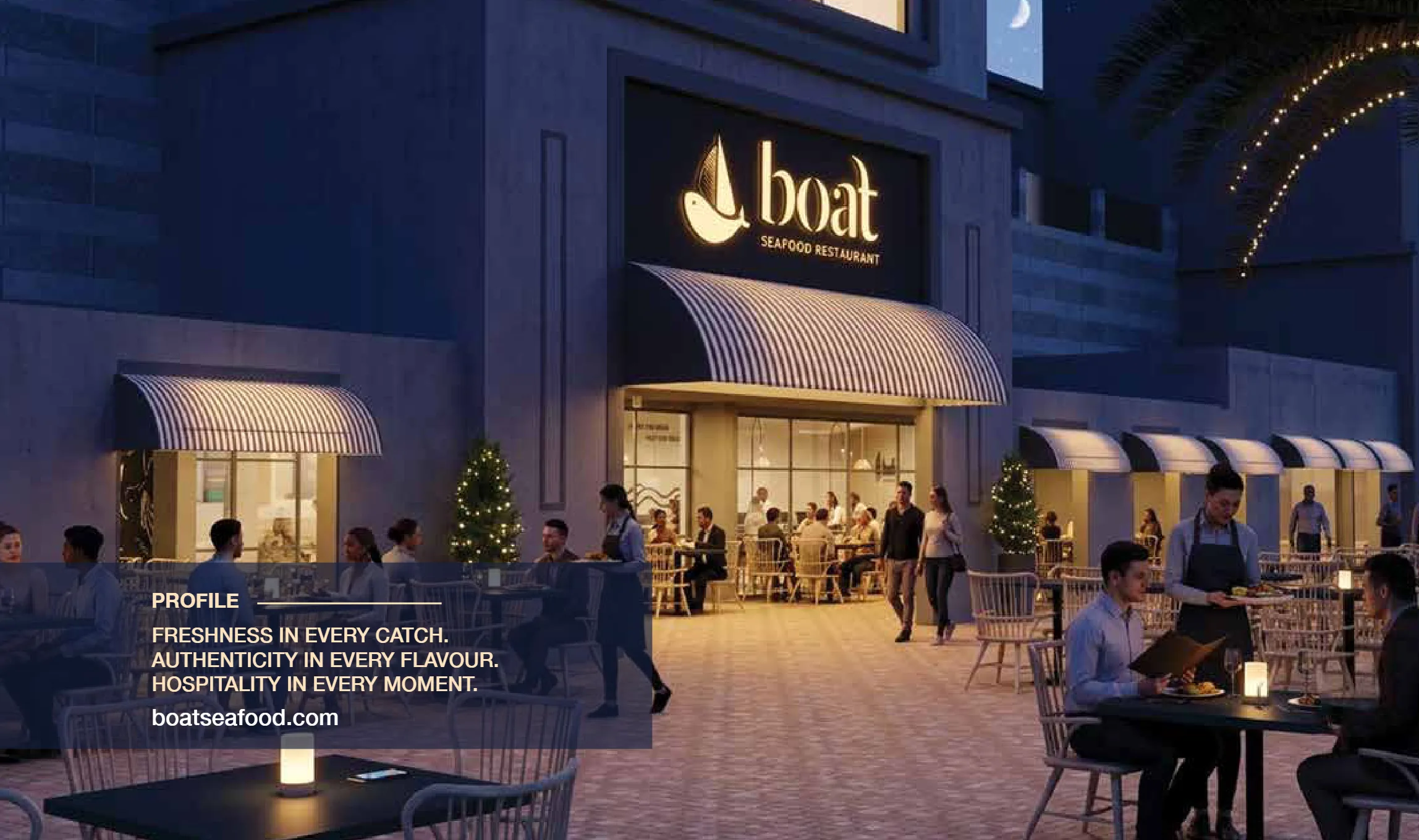 BOAT Seafood Restaurant at night, with guests dining on the terrace