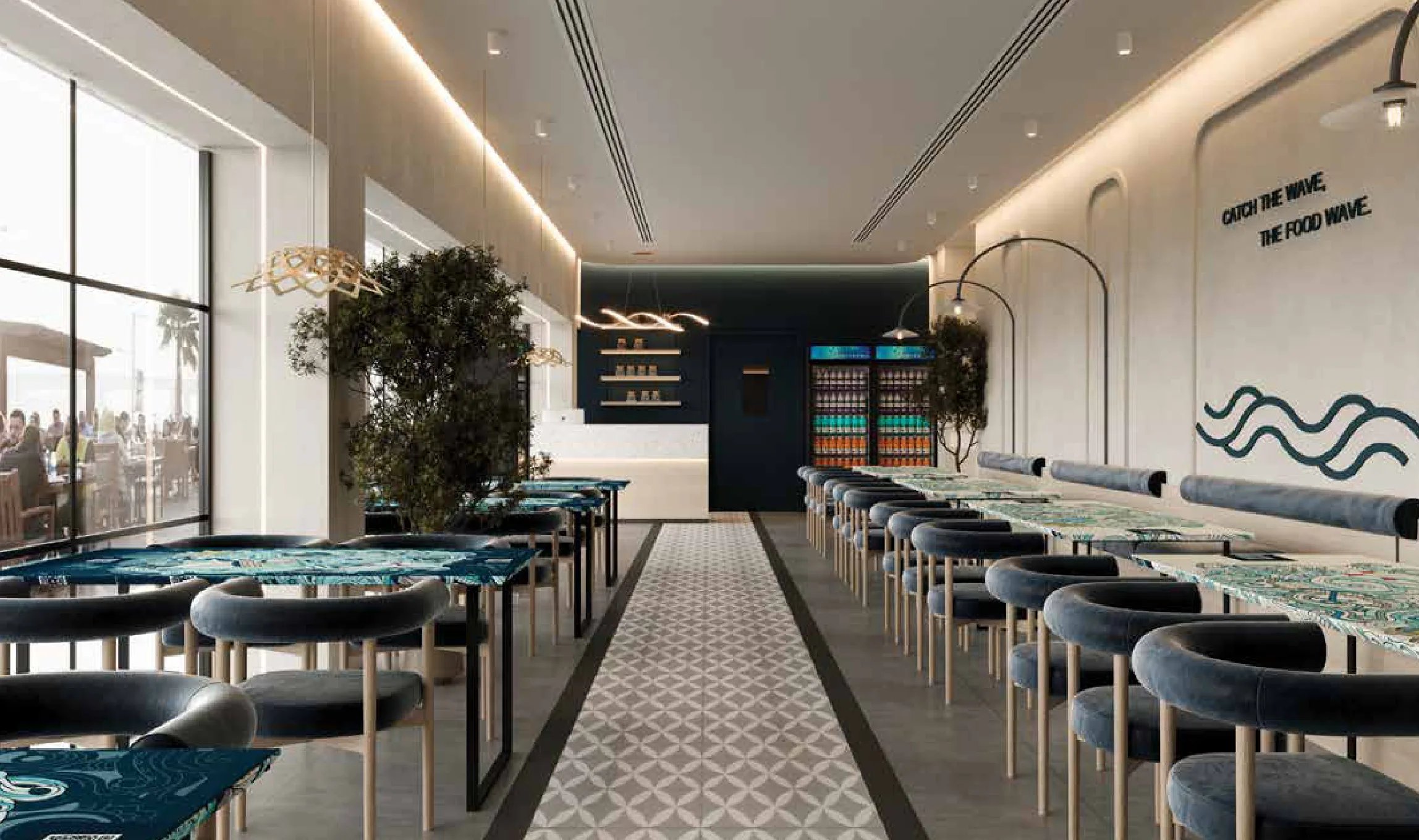 The BOAT dining room with ocean-blue tables and a 'Catch the wave' wall