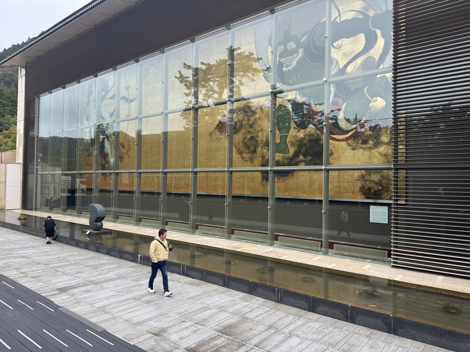 The Okada Museum of Art beneath a cloudy sky.