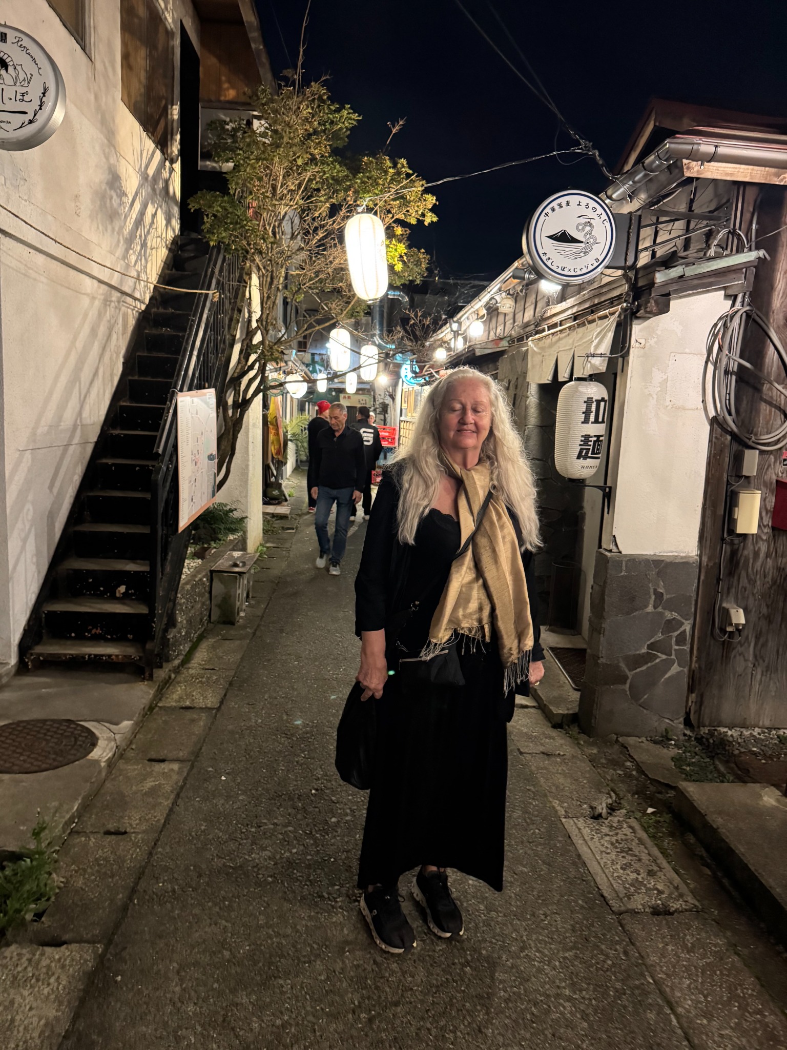Anneliese in a narrow evening lane.