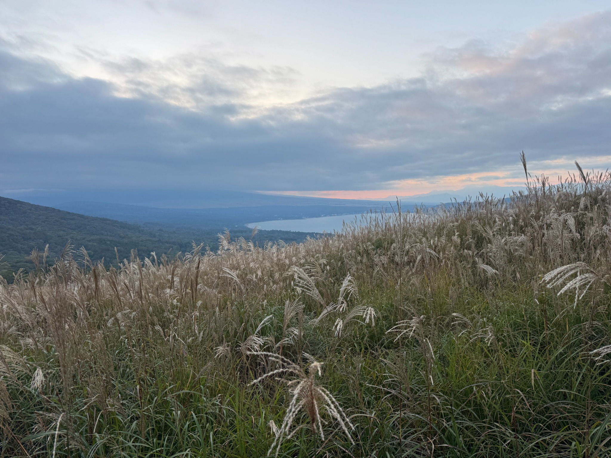 Sunset over a wide highland landscape.