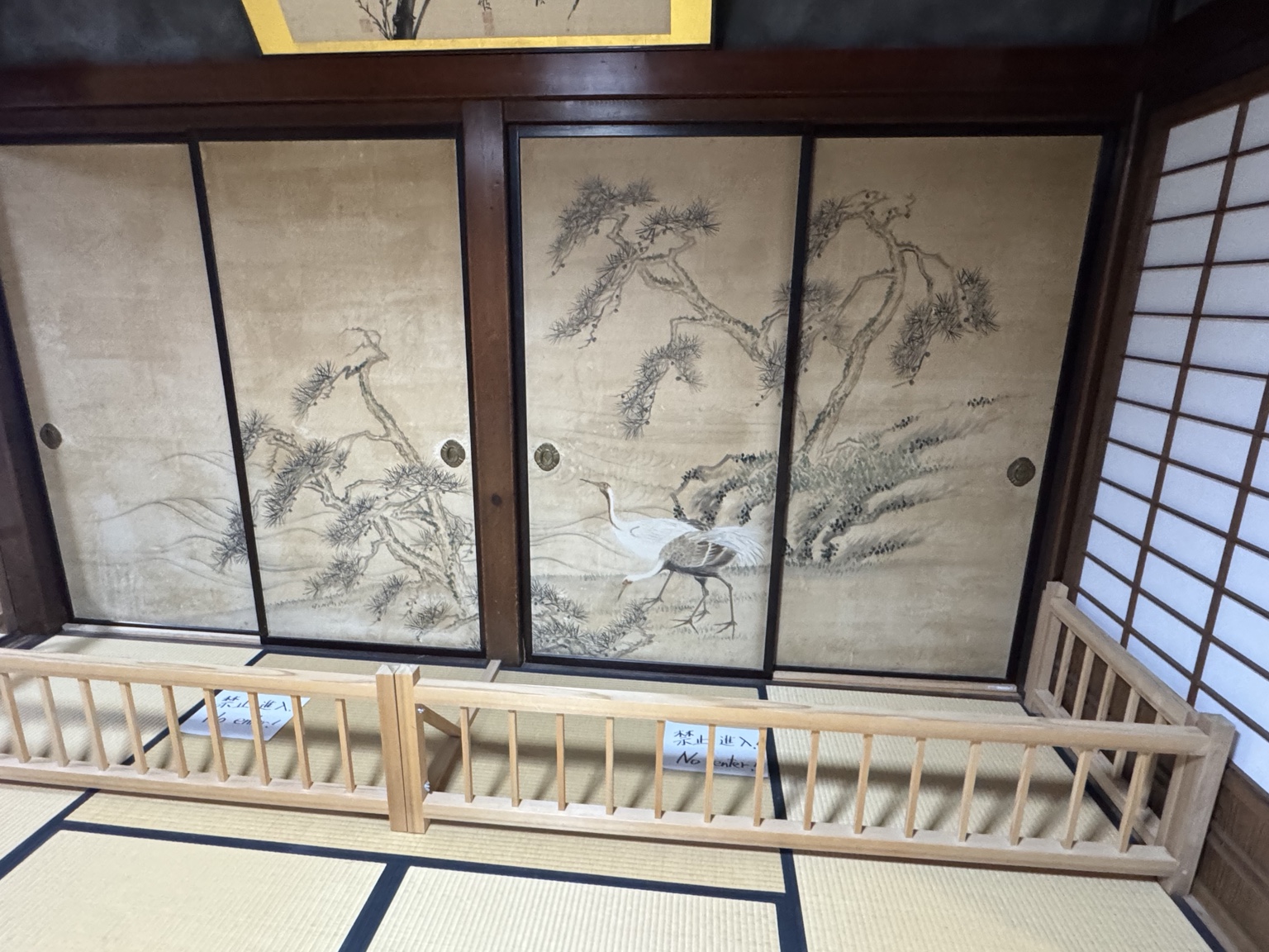 Cranes and pine trees on painted sliding doors.