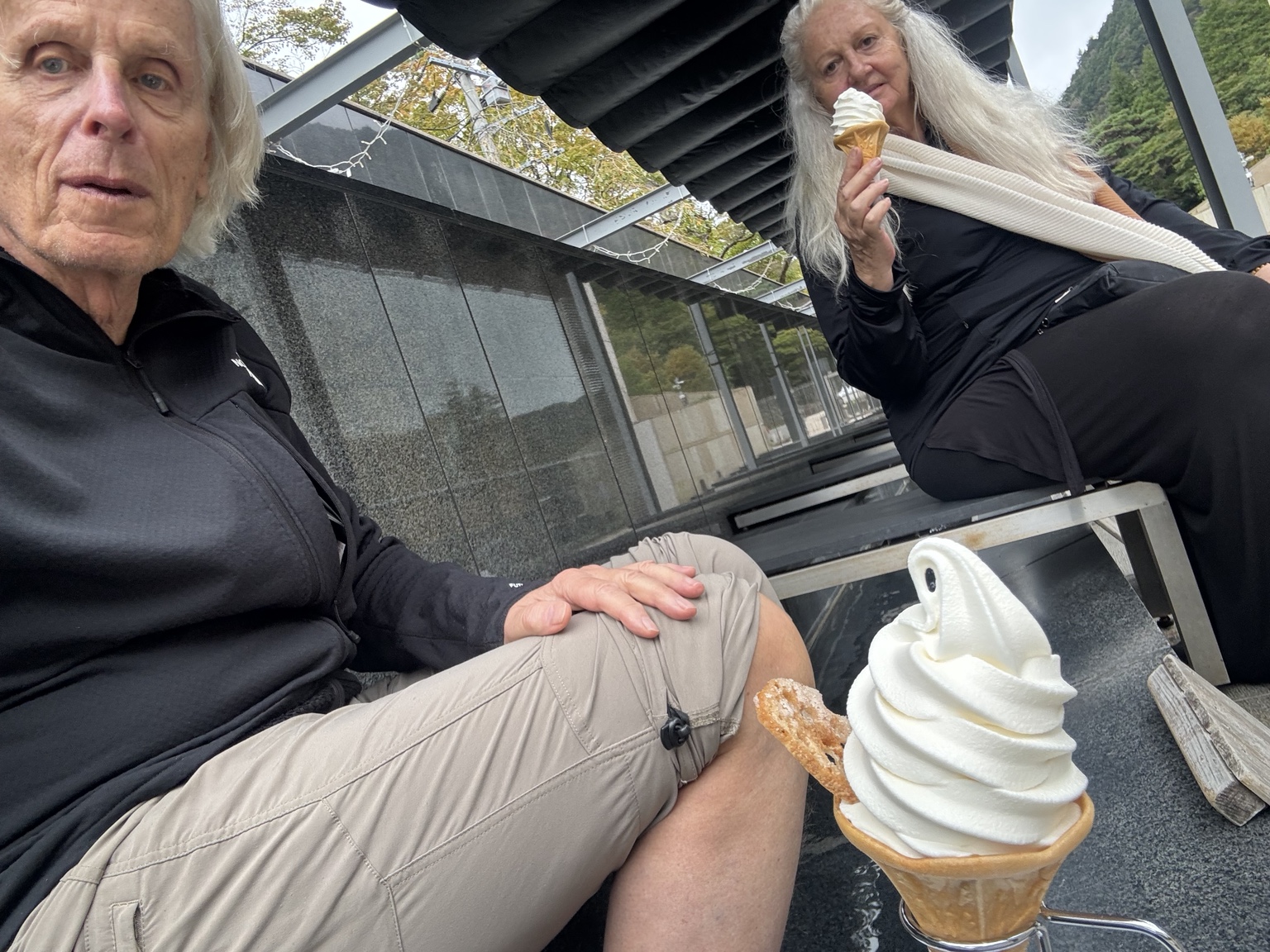 Ice cream in hand, feet in warm water.