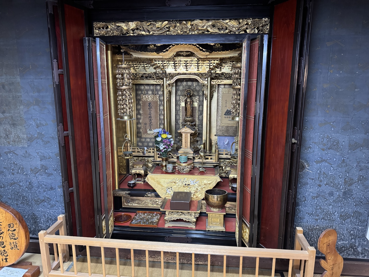 An intricately decorated Buddhist household altar.