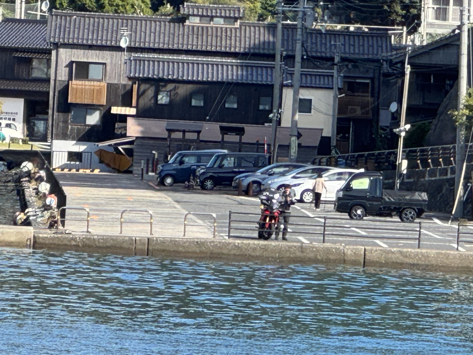Buildings and vehicles along the shore