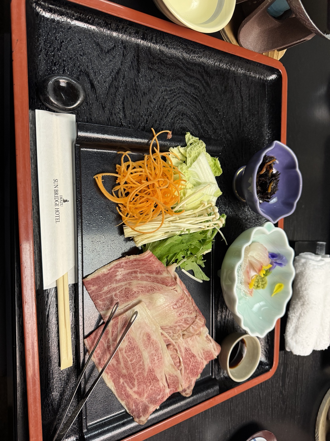 Finely marbled Wagyu beef, vegetables and small side dishes