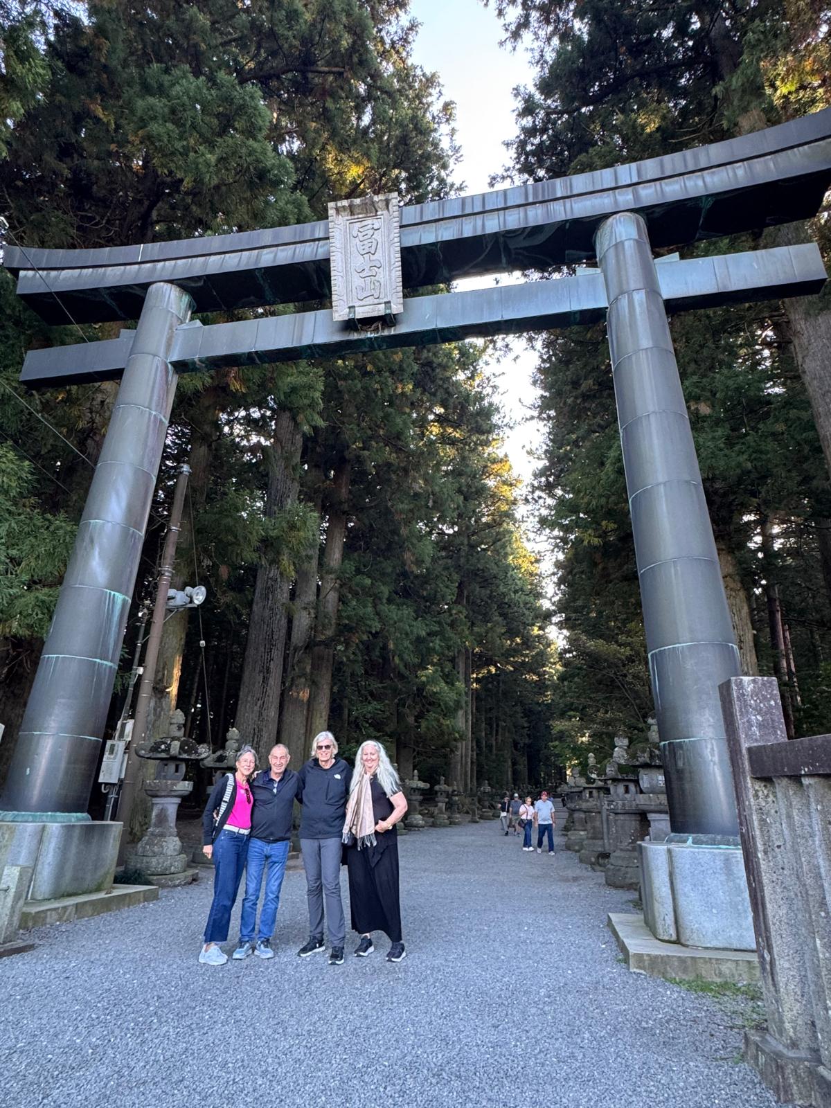 Together beneath the shrine’s torii gate.