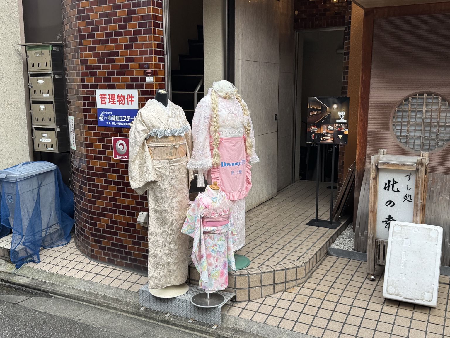 Pastel-coloured kimonos outside an entrance