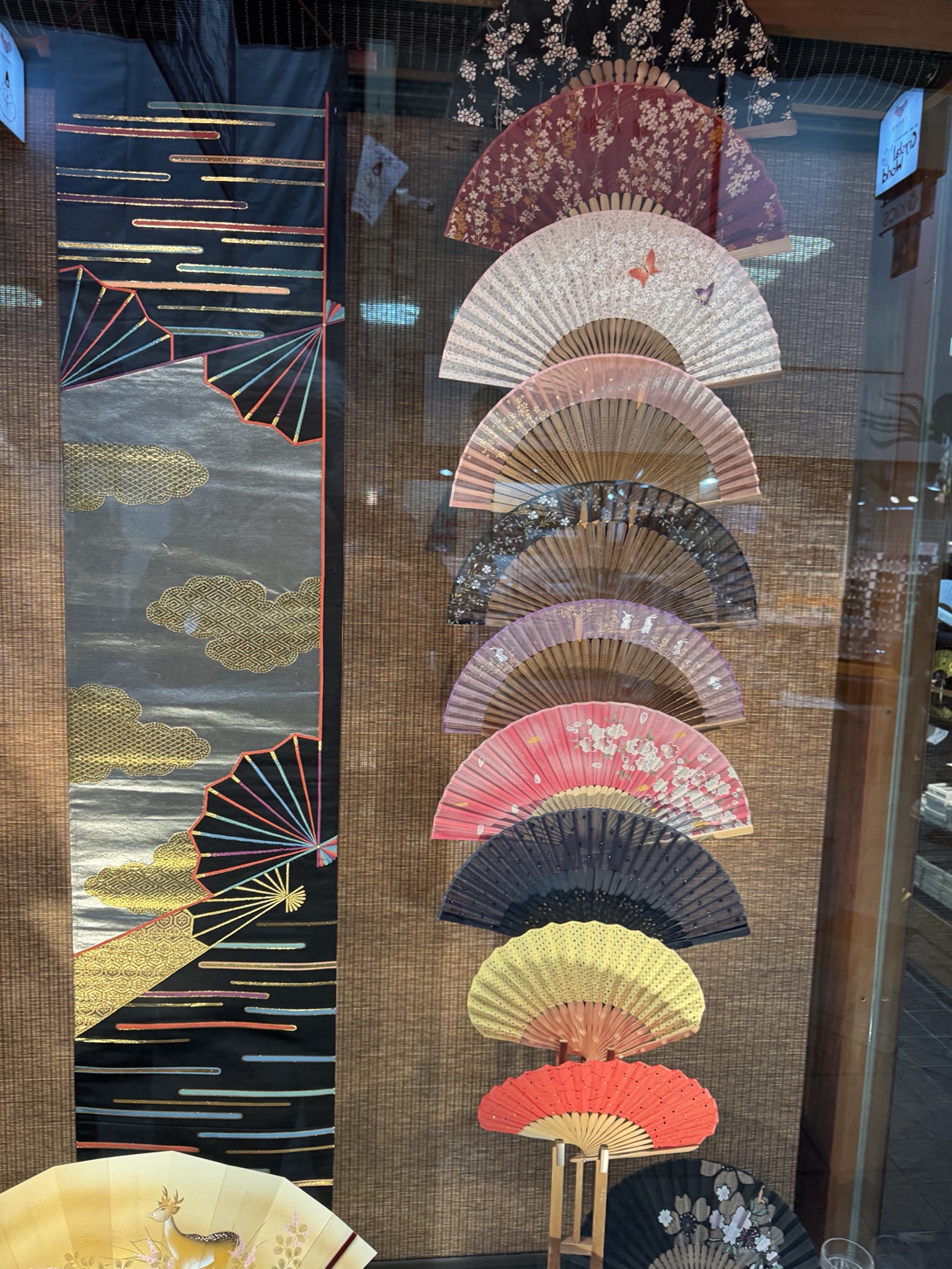 Decorative folding fans on display