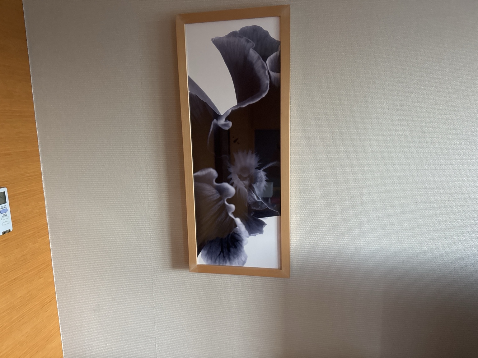 Framed floral artwork in the room.