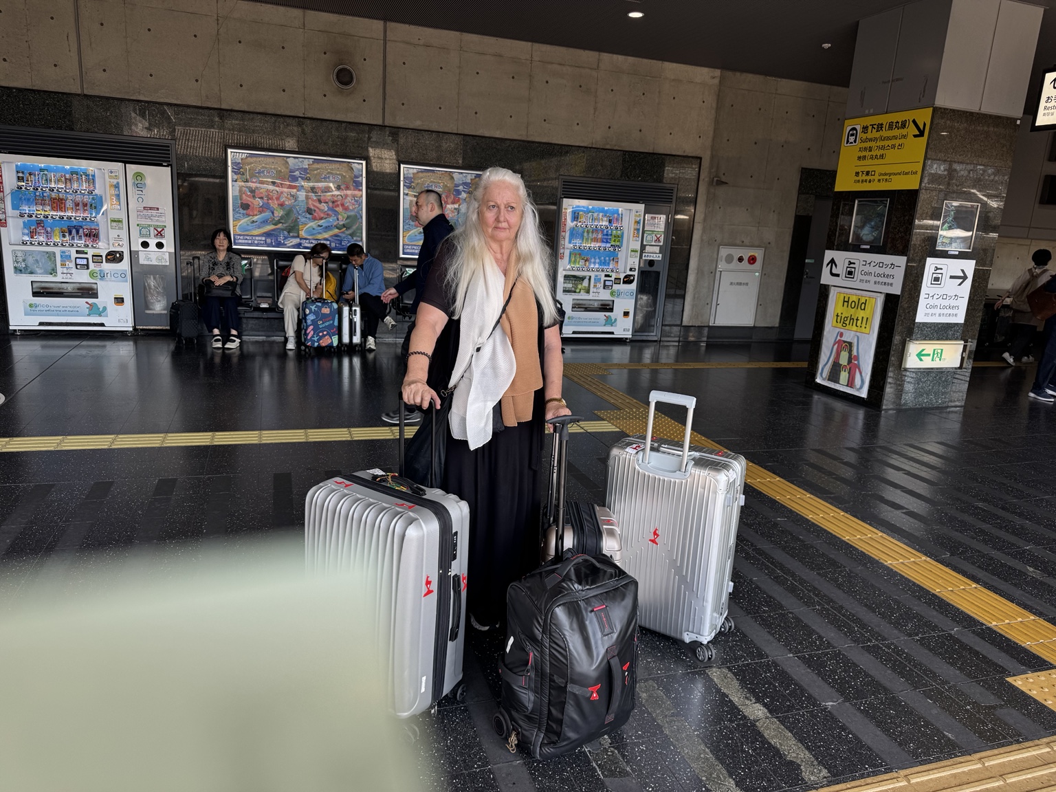 Anneliese and our luggage in the station hall.