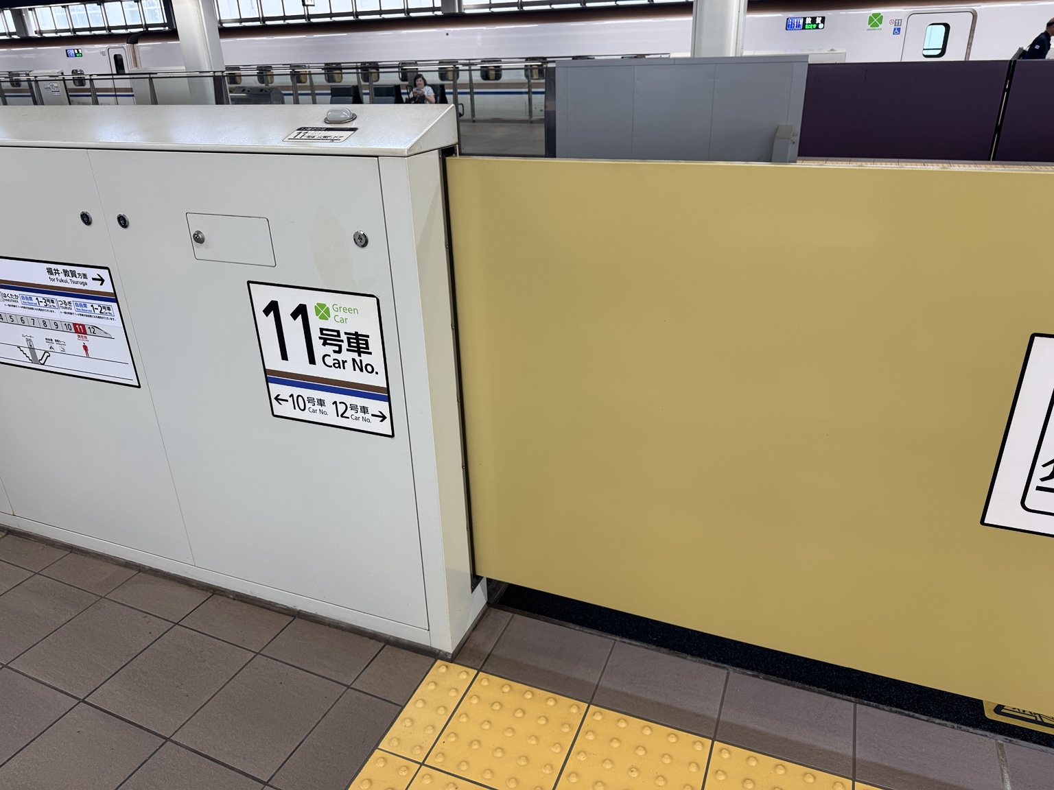 On the platform: the boarding marker for car 11.