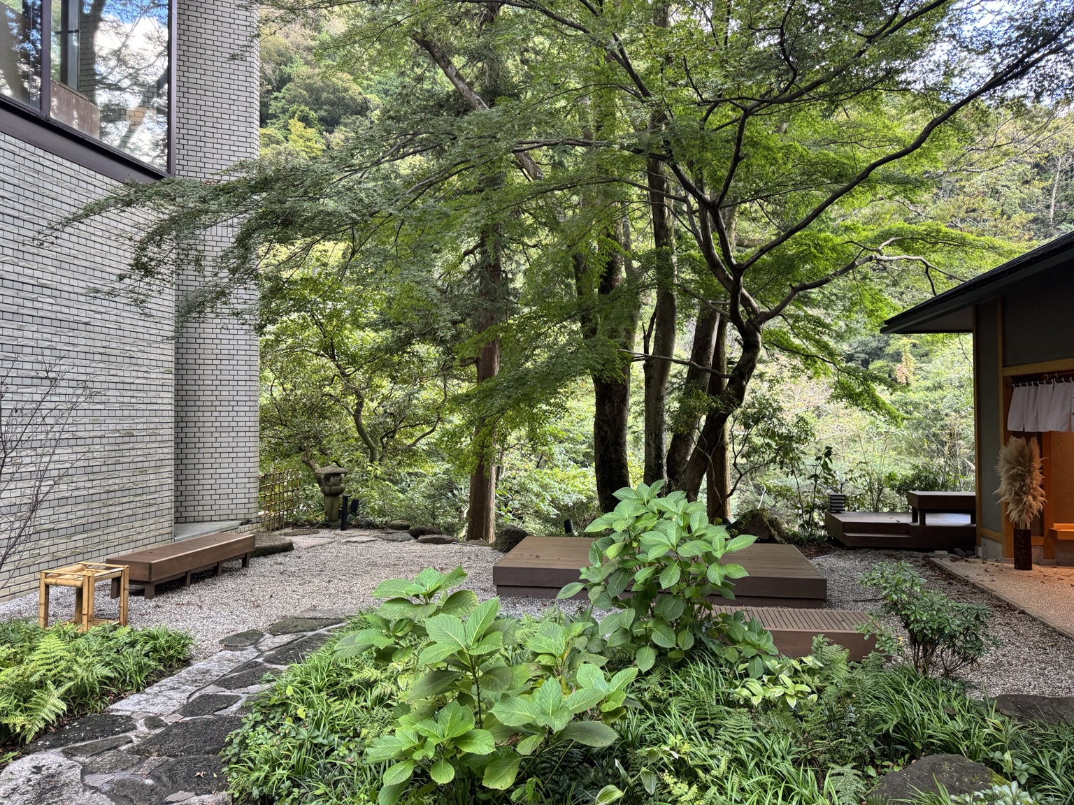Stones, trees and quiet paths at KAI Hakone.