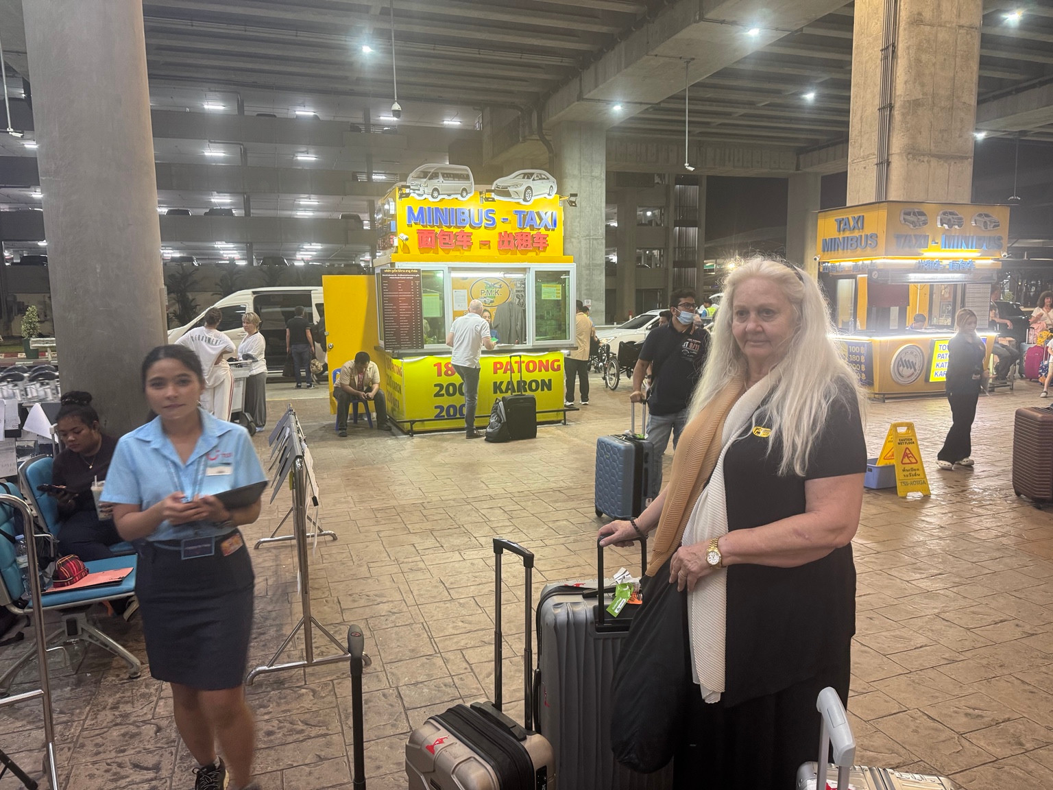 Anneliese with our luggage at the airport – the next part of our journey begins.