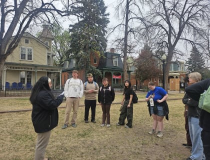 Students on a guided outdoor walking tour of a college campus