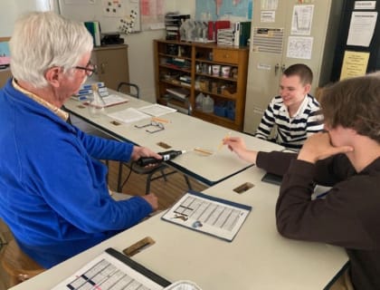 A high school student receiving one-on-one instruction
