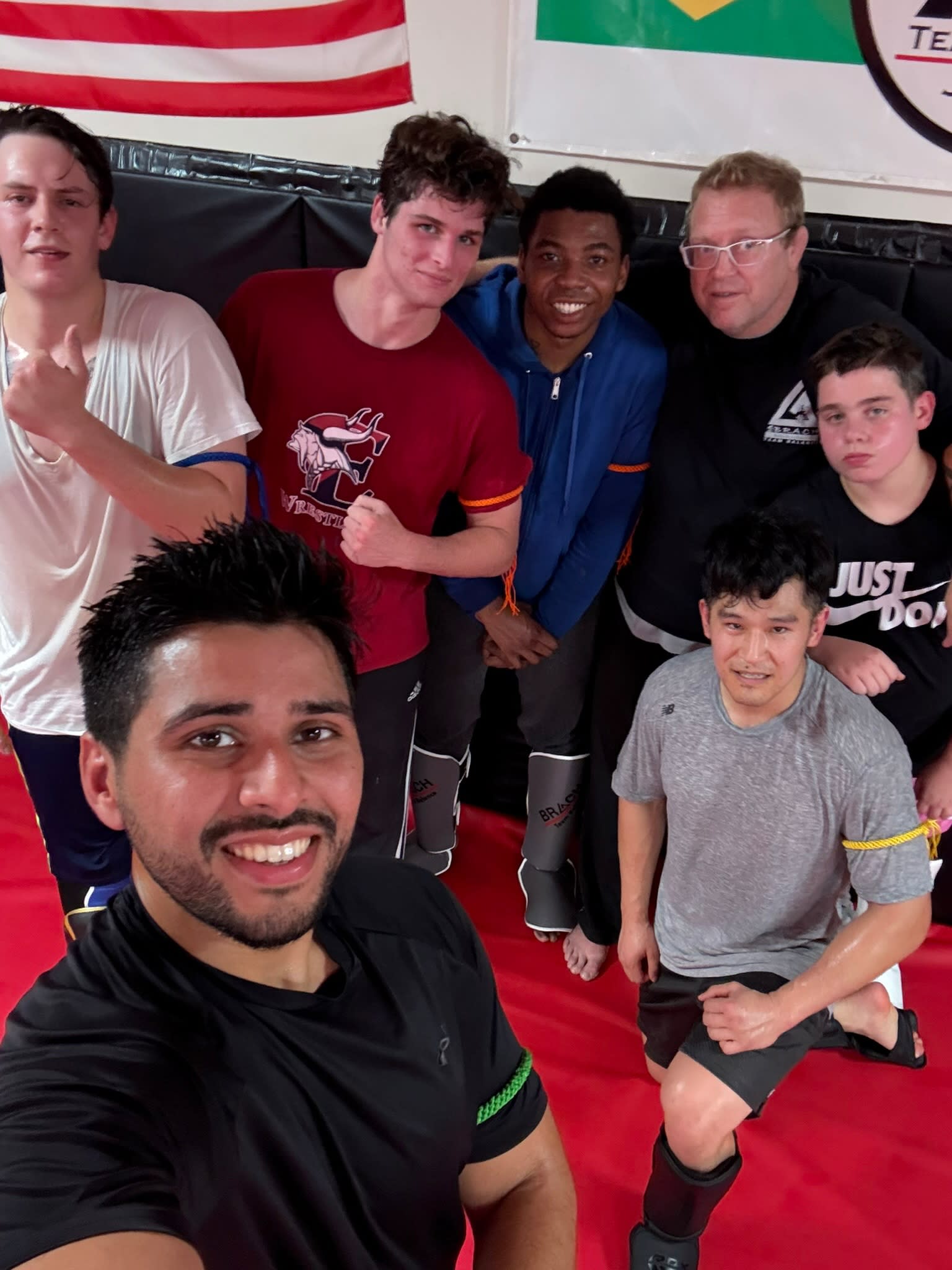 Muhammud Ali Khan coaching on the mats