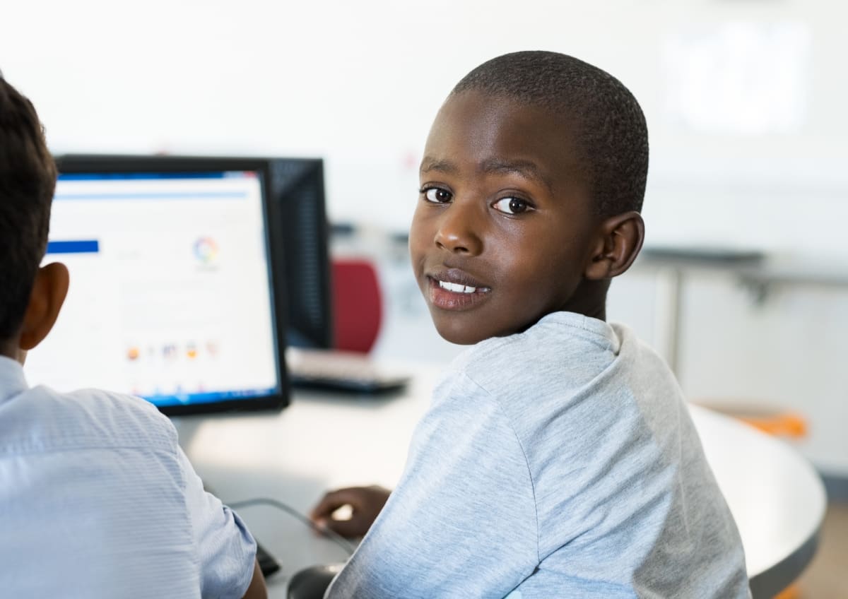 A child working at a computer at Elyton International School, Karen