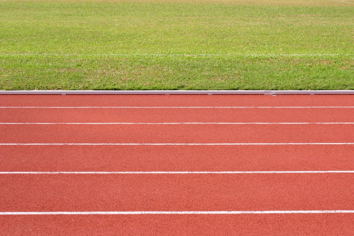 The 400-metre all-weather track curving around the playing field at Elyton, Karen