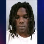 Twenty-year-old arrested after allegedly pulling rifle on aggressive dog
