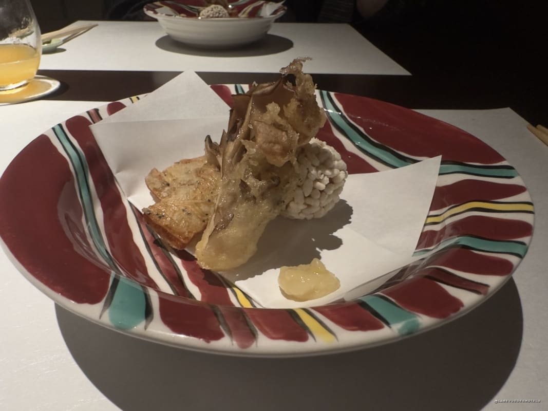 Tempura served on a Kutani plate with red and turquoise patterns