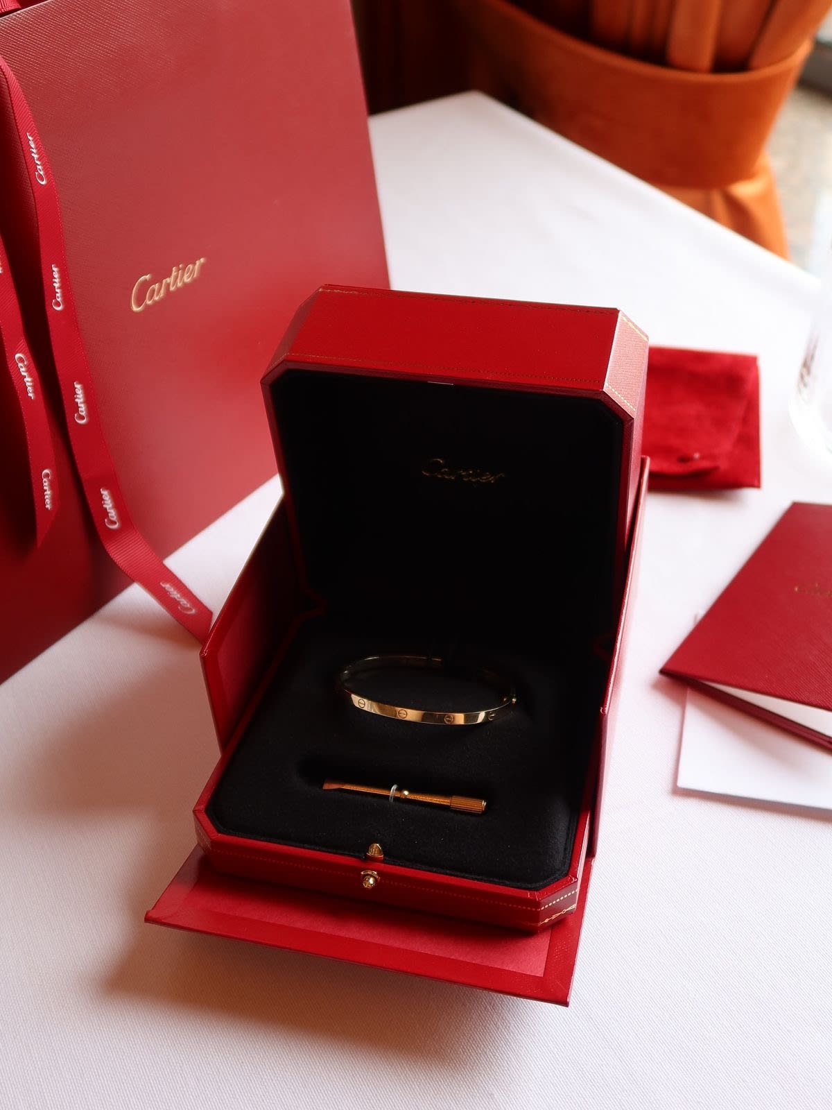 Cartier Juste un Clou gold nail bracelet in its red presentation box