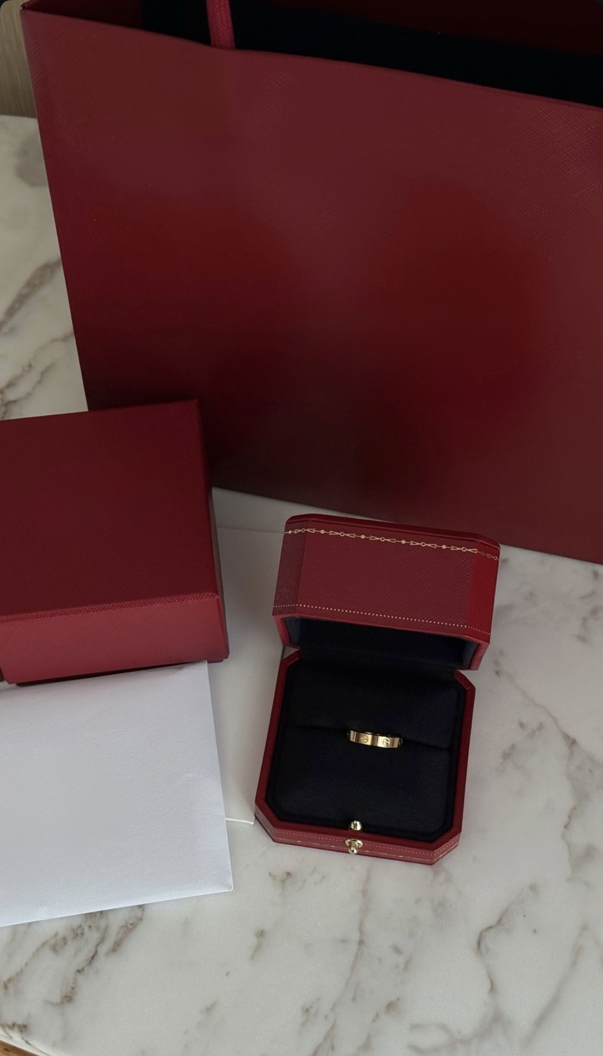 Cartier Love ring in its red presentation box