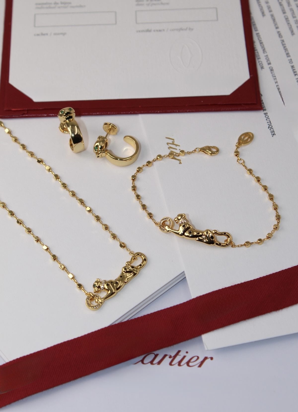 Gold Cartier panther motif necklace and bracelet with certificate