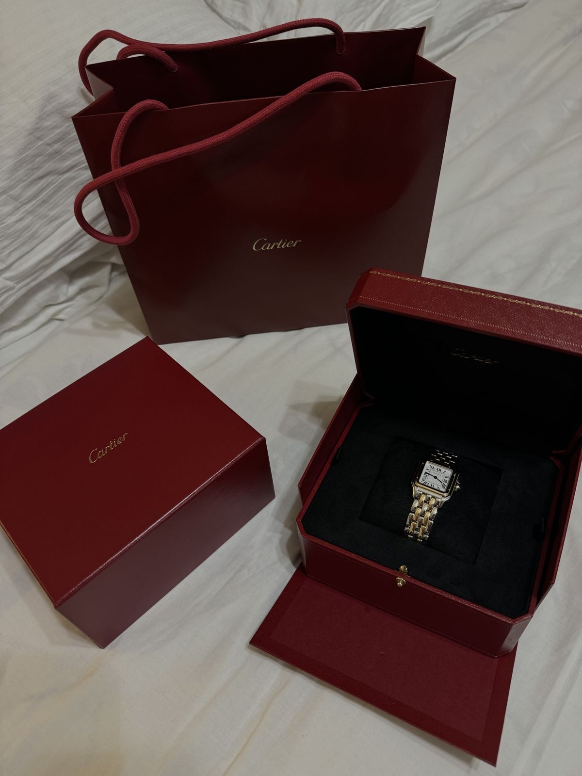 Two-tone Cartier Panthère watch with Cartier boxes and shopping bag