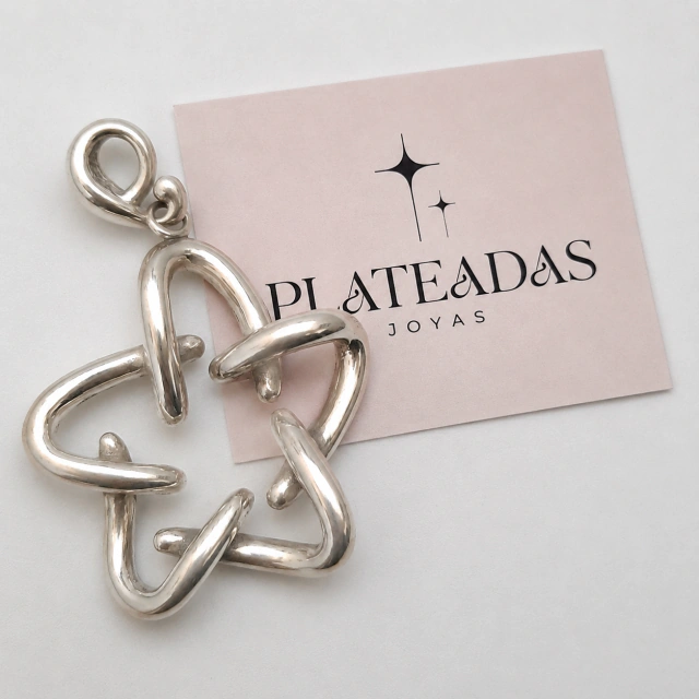 Dije de plata inflada estrella