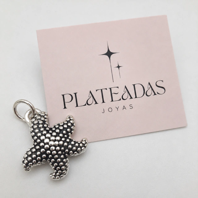 Dije de plata inflada estrella
