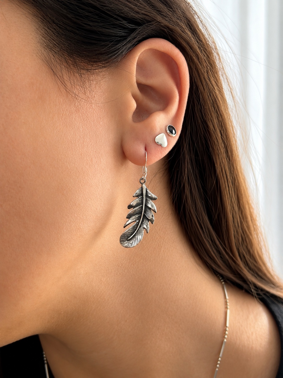 Aros de plata colgantes pluma