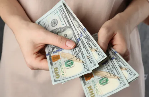 Woman holding alimony spousal maintenance money