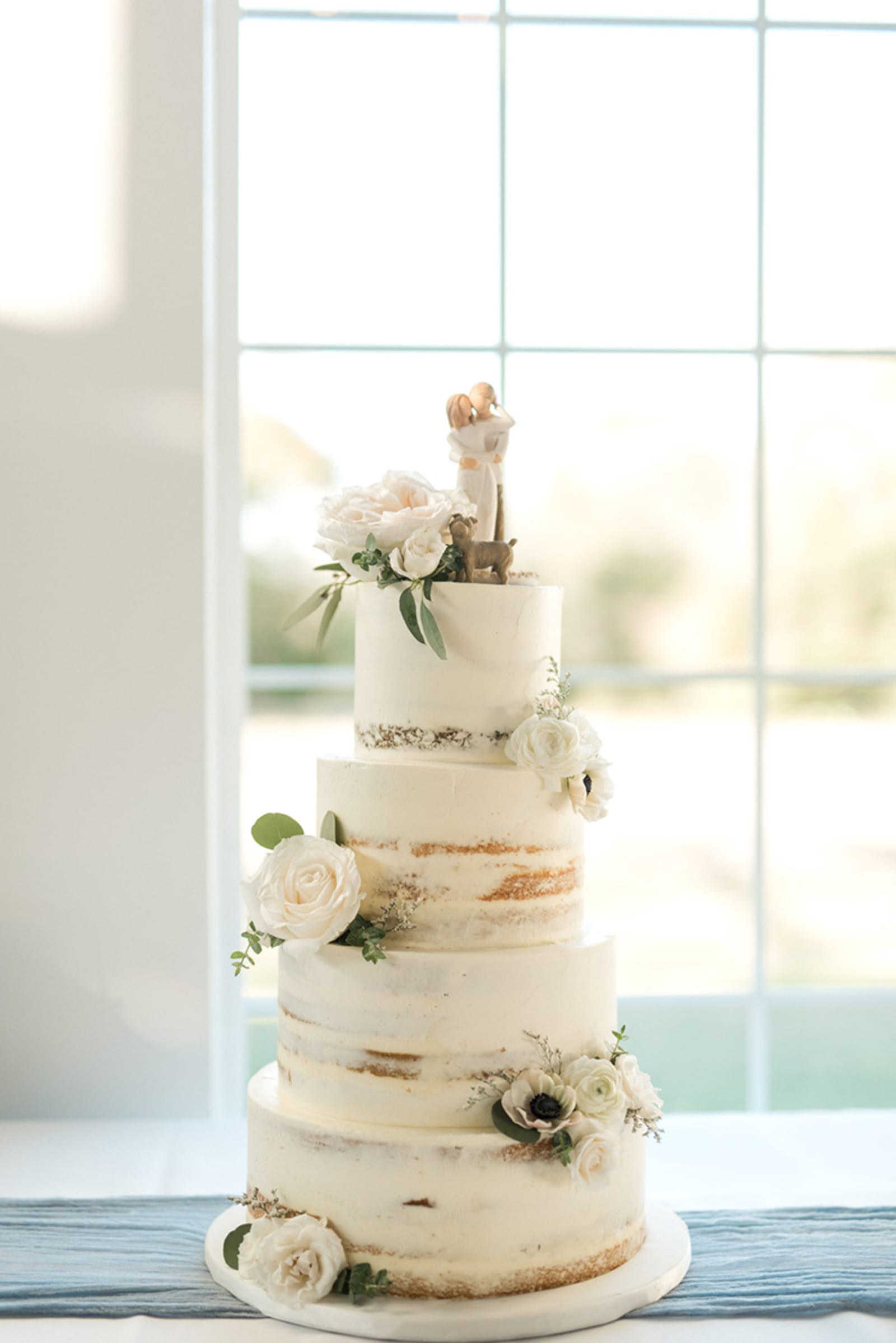 Four tier semi naked white flowers