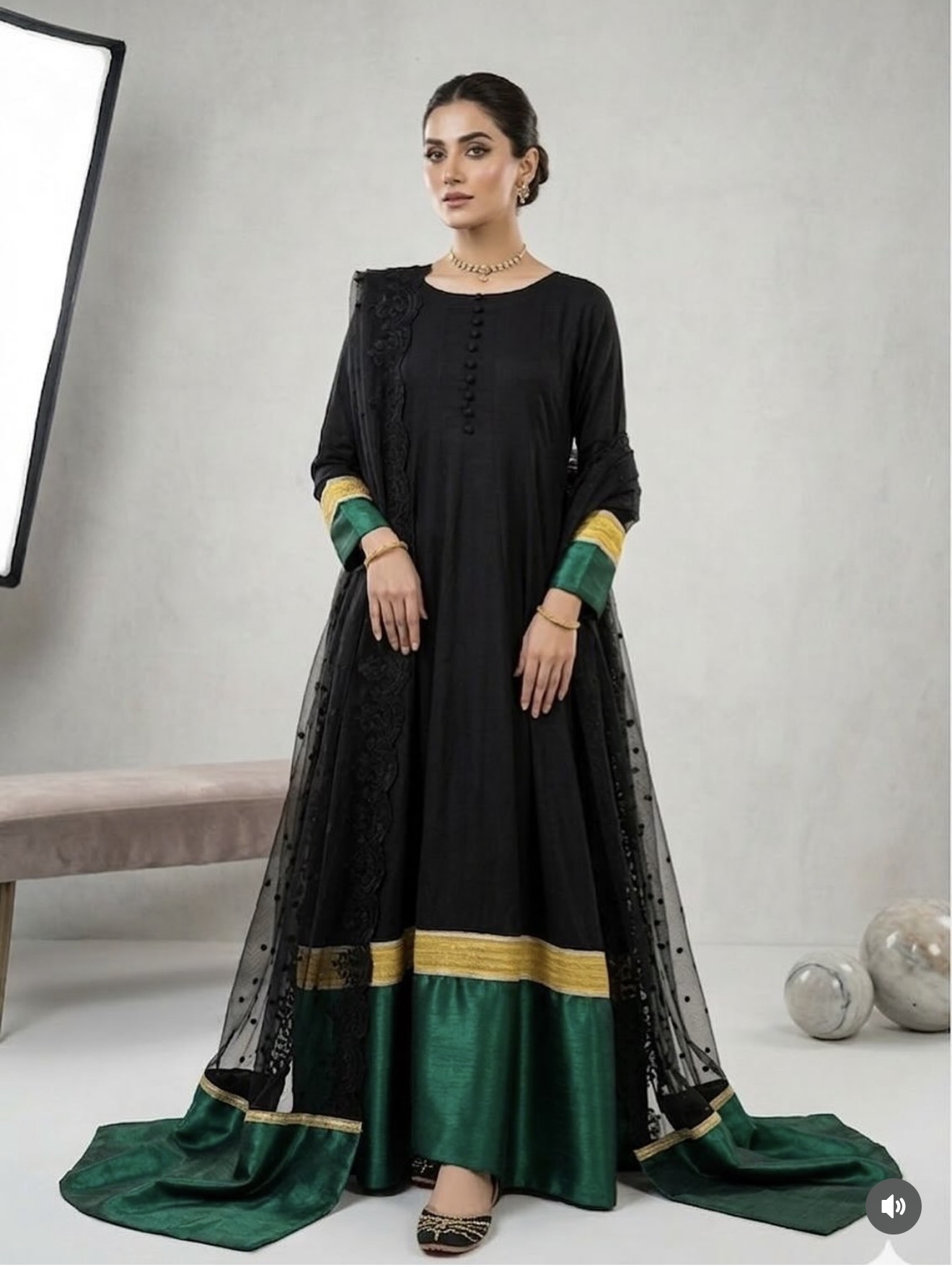 It’s a black silk frok with green border embroidered organza dubbata