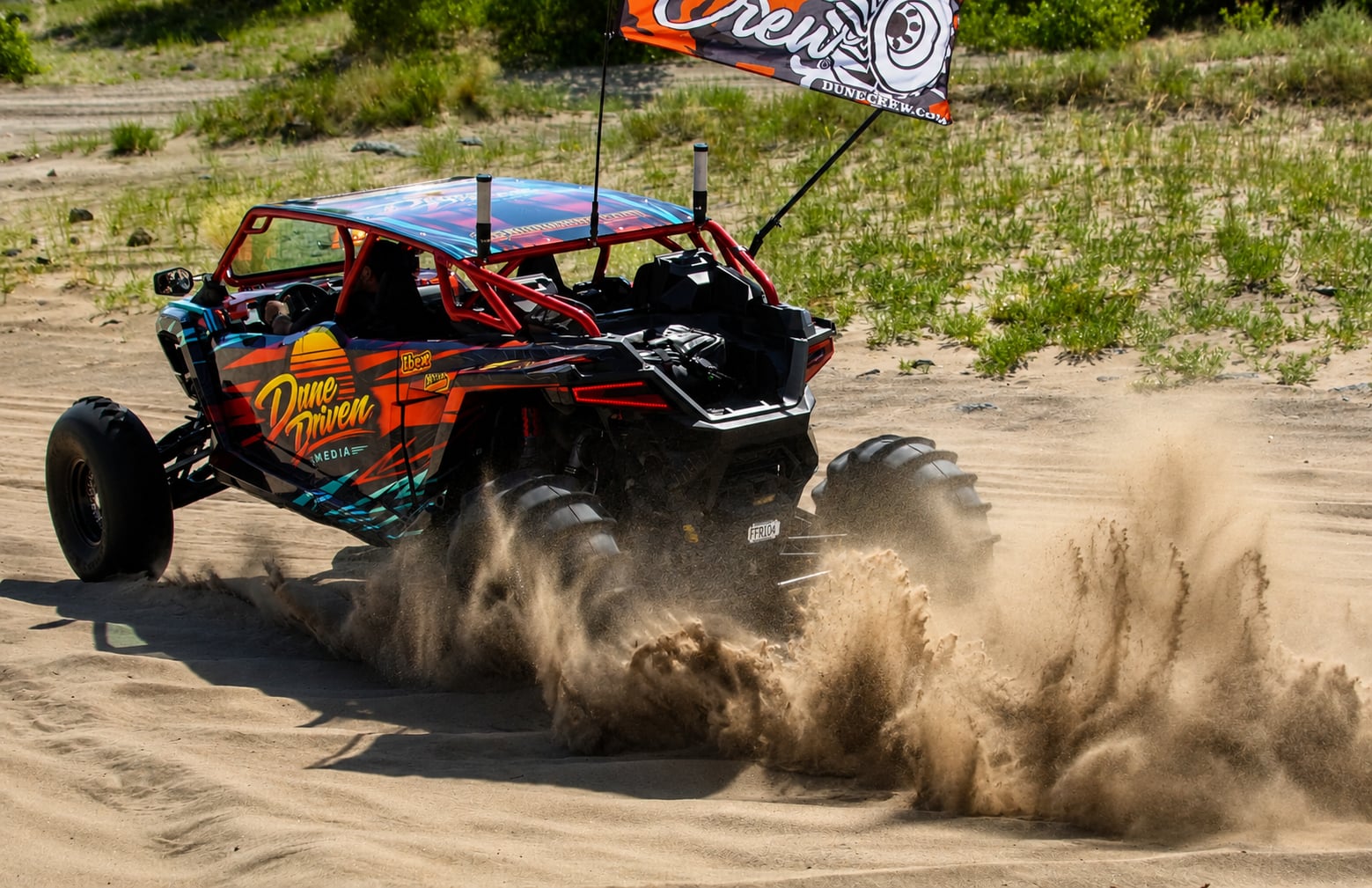 Dune Driven UTV kicking up sand on the dunes