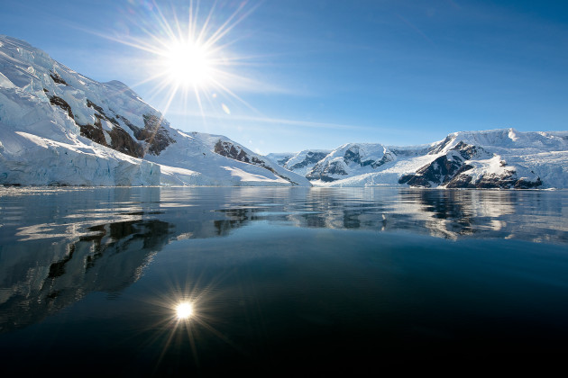 Antarctica can offer 24-hour light and a very low sun for a long time. When we were offered a zodiac trip late one evening it was easy to say yes. Shooting into the sun helped to add another dimension to this beautiful landscape. 14-24mm lens @ 14mm, 1/125s @ f8.