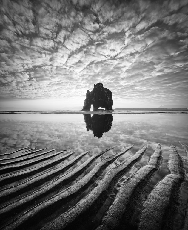 Troll Sea Stack, Hvitserker, Iceland. After a sunrise shoot at this sea stack I noticed these exposed ripple patterns in the sand and opted to use them as a foreground in this composition. I had to work fast as the incoming tide was moving rapidly. Canon 5D Mark II converted to 720nm infrared, Canon TS-E 17mm f/4L, 1/30 sec @ f11, ISO 100, tripod. Curves adjustments in Photoshop CC.