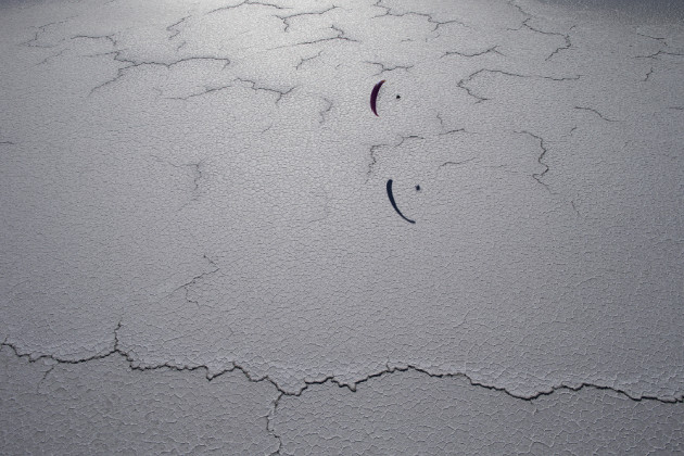 Paramotor pilot, Shane Denherder flies above the salt flats in Bonneville, Utah, USA. © Krystle Wright.