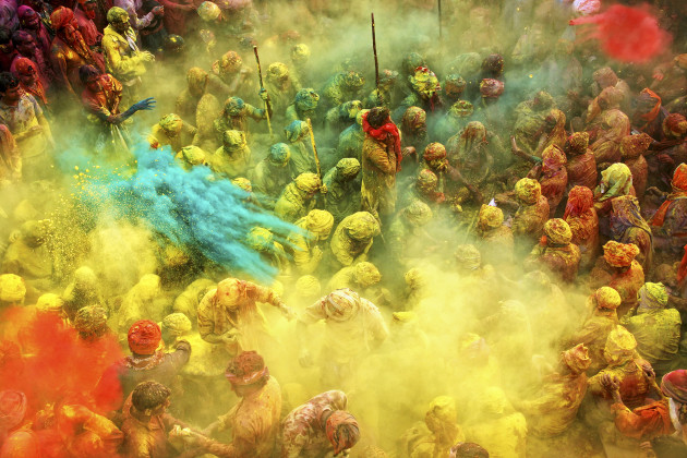 © Anurag Kumar
Grand Prize – Life in Colour category. “Each year, India witnesses an unprecedented wave of vibrancy and colour during Holi, the festival of colours, celebrated throughout the country. The photo could have been restricted to a red and yellow affair, had it not been for the man throwing a handful of blue powder which made all the difference. The seated worshippers in the photo, seem to be letting the barrage of colours layer them, which adds to the uniqueness of this photograph.”