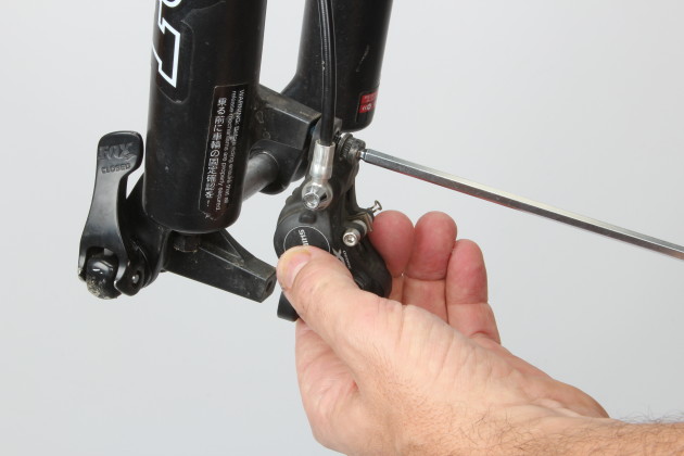 Start by removing your front wheel along with the brake calliper and hose. To avoid pad contamination, keep the brakes well away while you’re dealing with suspension fluids. A work stand will help if you’re leaving the fork on the bike but removing the fork completely makes life much easier.