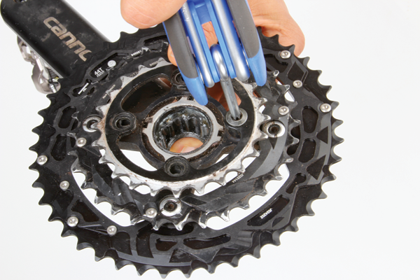 <p>As the final step in this cleansing process, remove all of your unwanted chainrings. You’ll either need a 5mm allen key or a torx wrench for this. In some cases you may need a specialist tool to hold the backside of chainring bolts. If you’re planning to use a guide to keep the chain in place, you could reuse the middle chainring but it’s advisable to get a single-specific chainring for the task. If you had a triple crankset, place your new cog in the middle ring position. When converting a double ring, the placement will depend on the crank and chainring combination that you are using (the main goal here is to achieve a good chainline).</p>