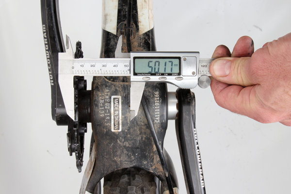 <p>Check that the chainline is within a normal range. Find the centre line of your frame and measure out to the centreline of the chainring. The teeth should sit somewhere between 46 and 52mm out from the centre of the bottom bracket. If you get a measurement that’s way out of this range, you may be able to shift the chainring position by adding or removing spacers from the bottom bracket. If the bottom bracket doesn’t allow for any adjustment (often the case with press-fit systems), you could also tweak it by using chainring spacers.</p>