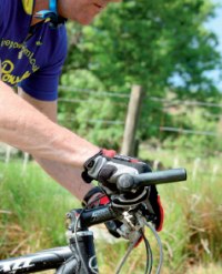 Maintain a relaxed grip on the bars and keep your arms loose