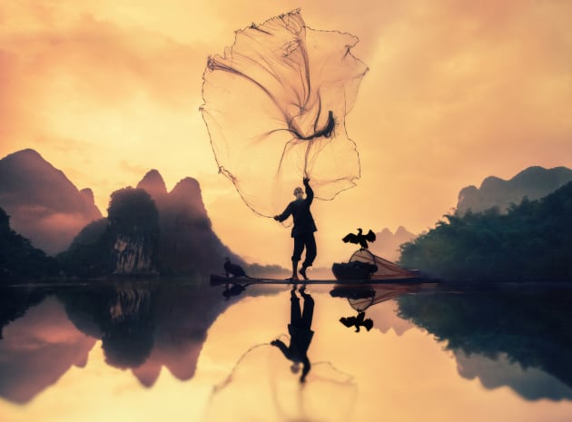 This fisherman gets up before sunrise and go fishing with a gas lamp, a net, and a bird who helps him fishing. This kind of fishing is a thousand year old tradition that some chinese fishermen keep it alive. I got up an hour before sunrise and followed him with his daily journey in river Lee. I even went into the water to get a different angle for my shot . Copyright: © Khalid Alsabt, Saudi Arabia, Commended, Open, Travel, 2017 Sony World Photography Awards.