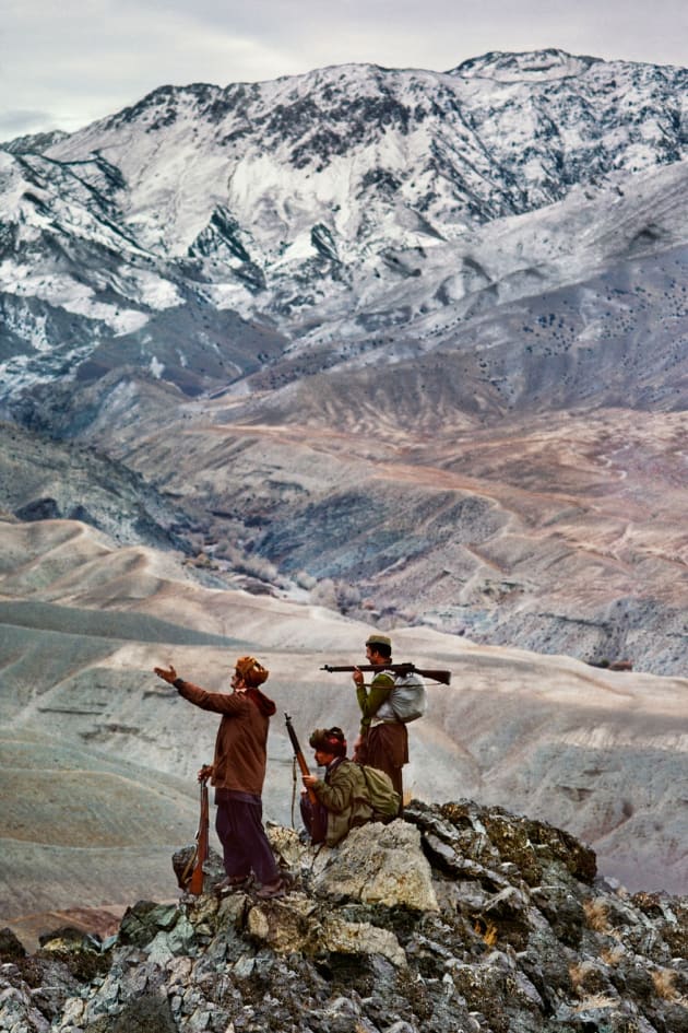 Logar province, 1984. Three mujahideen on a mountain in the Hindu Kush range.